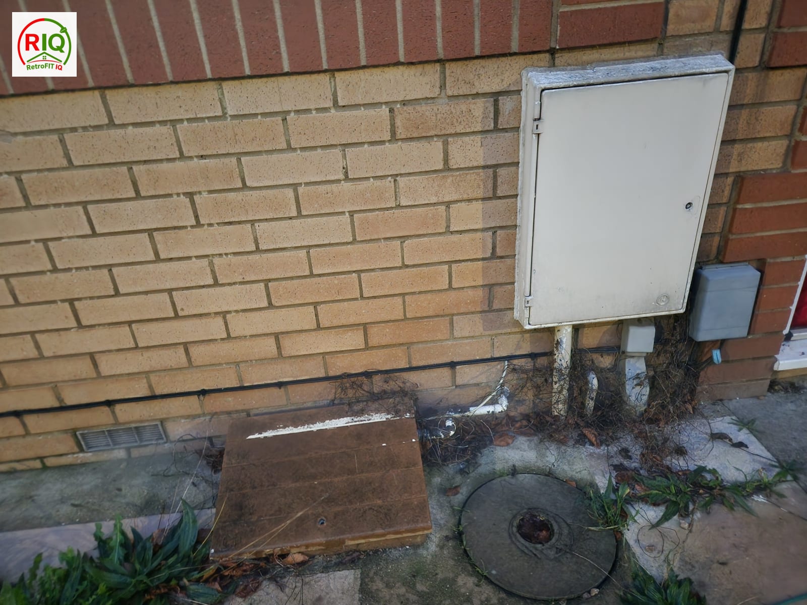 Air leakage at unsealed pipe and cable service penetrations through an external wall, found during testing