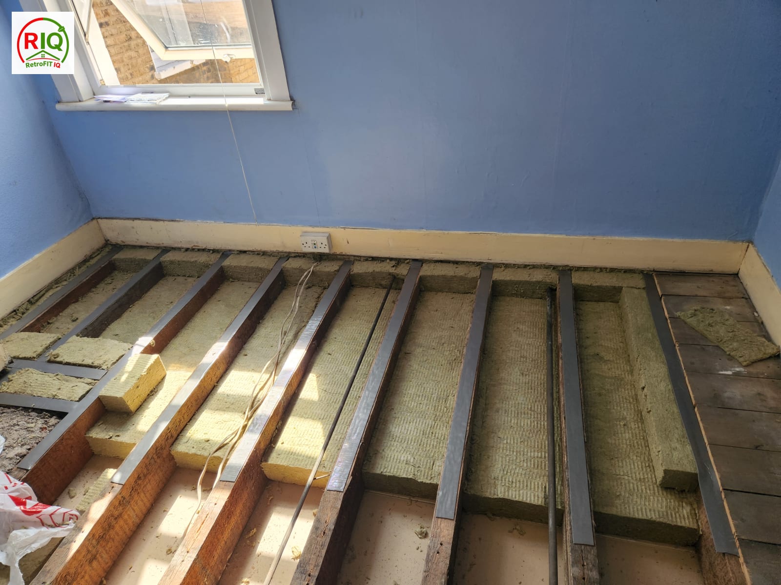 Soundproofing floor build-up with mineral wool and resilient bars decoupling the new deck — North London
