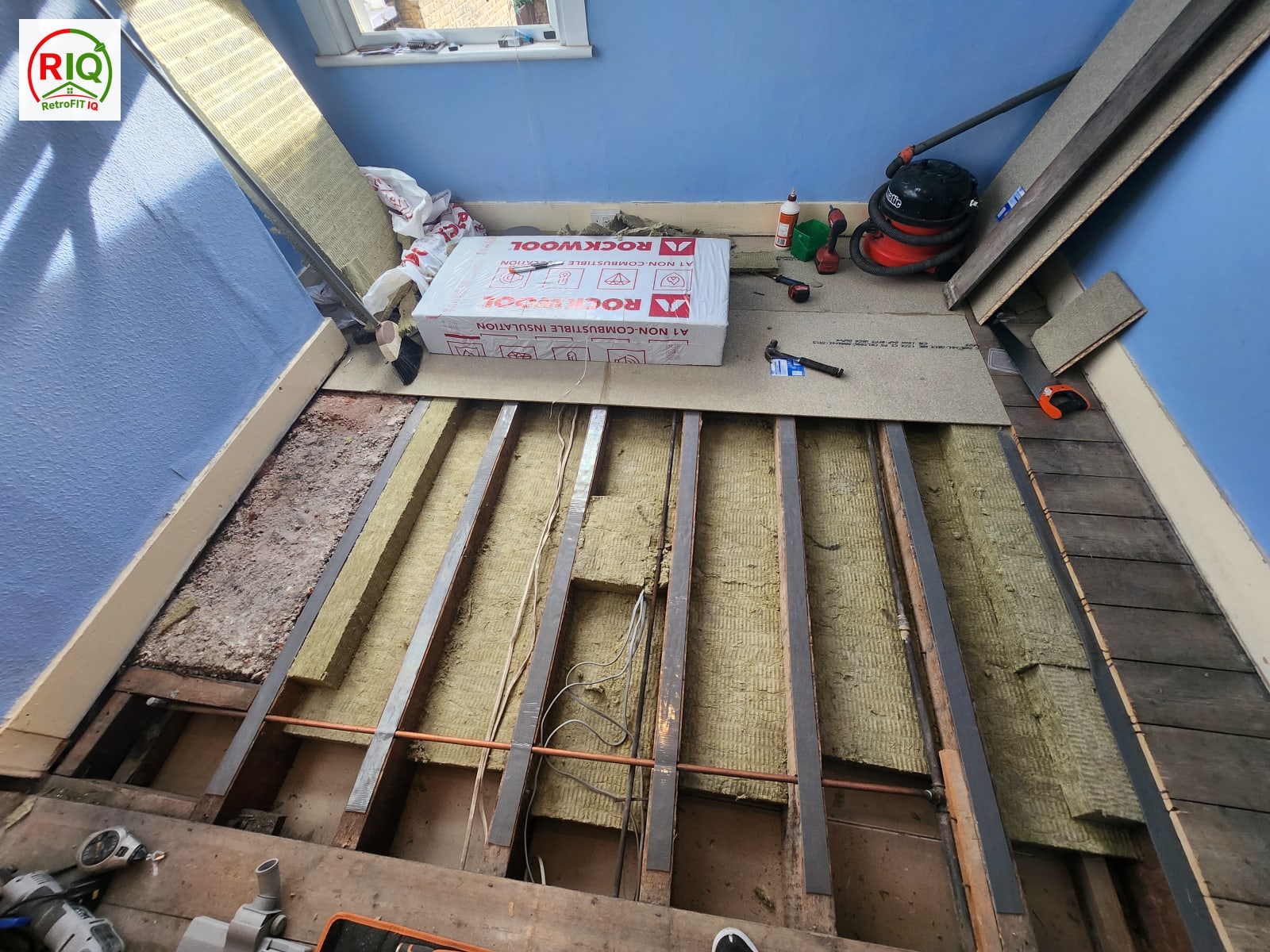 Acoustic floor soundproofing mid-installation with Rockwool and resilient acoustic bars — North London
