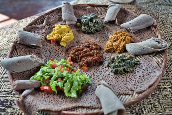 never-better-maskal-teff-plate-of-injera-bread-and-sauces