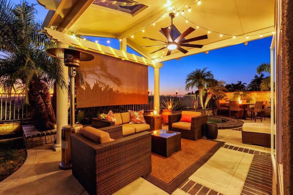 Stunning Resort style backyard with full Barbeque, seating, and fire table.  
Perfect for entertaining,  while overlooking Lake Mission Viejo. Perfect for Entertaining day or a beautiful balmy Ca night