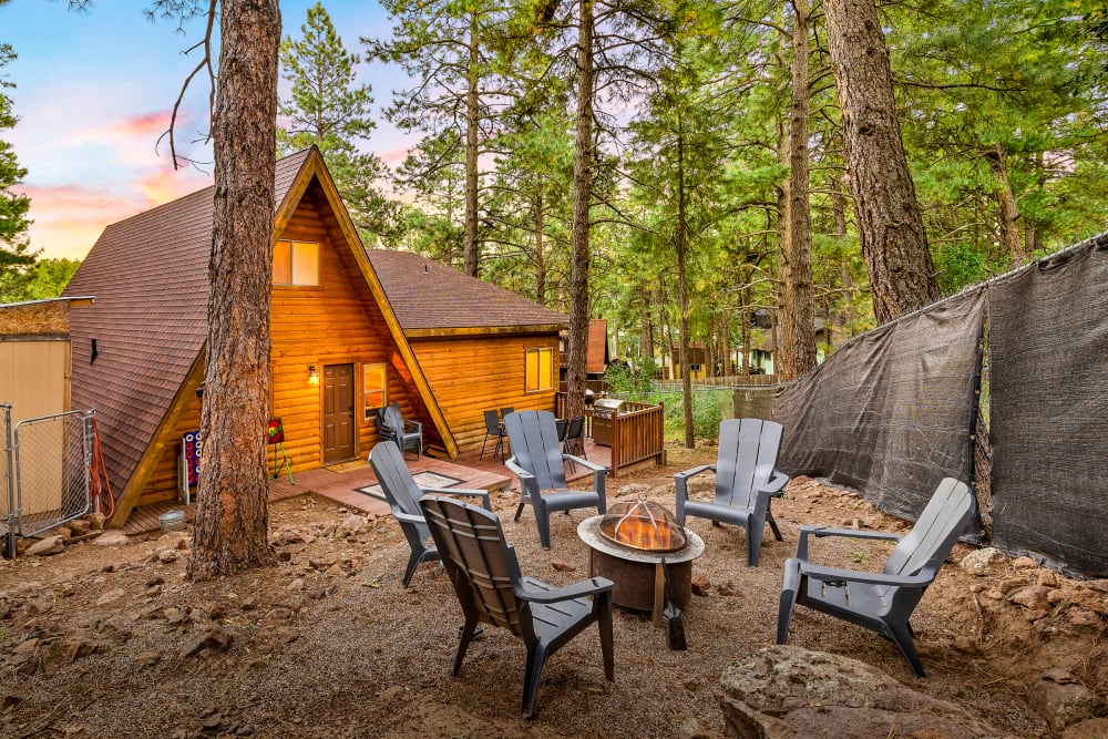 Back yard fire pit- perfect spot to enjoy a cozy twilight fire under the stars in the serene pinion pines.