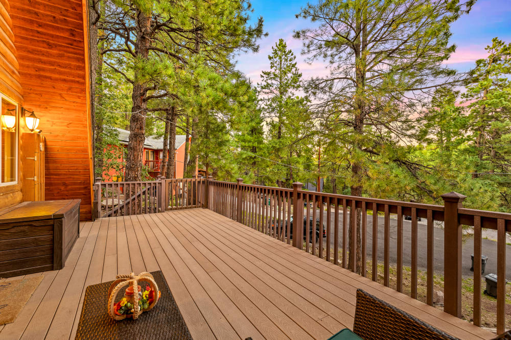 Large front deck with views of the stunning pines; perfect for star gazing, relaxing adult beverage, and morning sunrise, and a perfect cup of complimentary hot beverages.