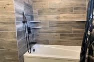 Bathroom #4 on the West-Wing also includes custom tile, a rain shower over head, hand held shower, rainfall tub fill, and extra deep tub. (Duplicate bath on East Wing)