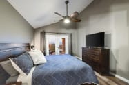 Bedroom #4 west-wing, Master bedroom with work station, Tempur-pedic King mattress, and barn doors leading to private bathroom