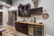 Great Room Wet Bar with butcher block counter, bar sink, 50 lb Ice maker (never run out of ice), beverage cooler, plenty of bar glassware, bar accessories, blender, etc.