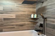 Bathrooms have deep tubs, custom tile, rain shower heads and hand held shower heads. 