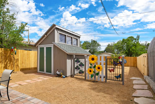 The large backyard is a fun and spacious area, perfect for gatherings and outdoor activities.
 A cozy patio with comfortable seating and a barbecue grill makes it an ideal spot for entertaining friends and family.