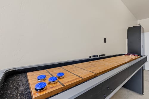 Garage converted game room with professional grade dart board, and shuffle board!

Equipped with Alexa for your music, and fun entertainment.