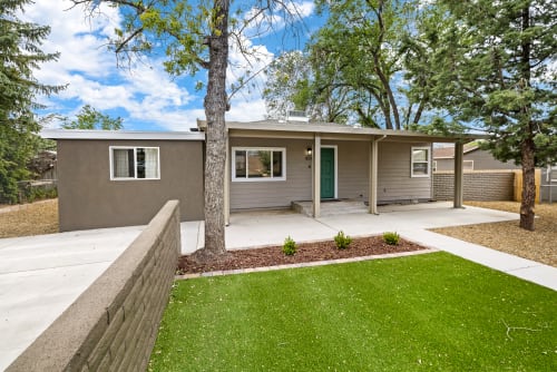 
The exterior of this charming three-bedroom home exudes warmth and appeal. The house features a classic design with a welcoming front porch, perfect for enjoying a morning coffee or evening sunset. The well-maintained façade is complemented by tasteful landscaping, and plenty of parking.