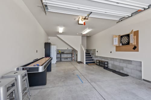 Garage converted game room with professional grade dart board, and shuffle board!

Equipped with Alexa for your music, and fun entertainment.