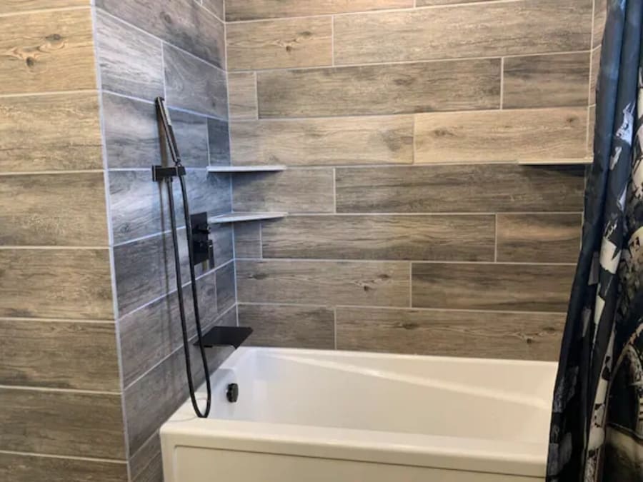 Bathroom #4 on the West-Wing also includes custom tile, a rain shower over head, hand held shower, rainfall tub fill, and extra deep tub. (Duplicate bath on East Wing)