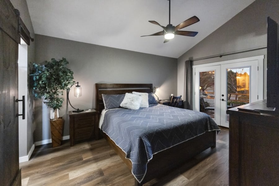 Bedroom #4: West Wing Master Bedroom. French Doors leading to patio w seating. Private bathroom w incredible walk in Rain Shower. Searta Double Pillow top comfortable King Mattress. 55” Smart TV. Work desk w full gigabit internet. Large walkin closet