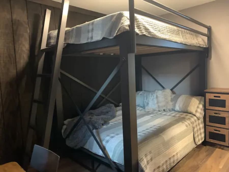 Bedroom #3 located in the East-wing with Queen over Queen industrial strength bunk beds, desk/work space,  black-out curtains, closet with full length mirror doors. 