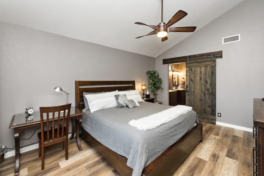 Bedroom #1, East-wing Master Bedroom, with work area desk, 55” Smart TV, private bathroom with AMAZING walk in rain shower, black-out curtains, private balcony with seating. 