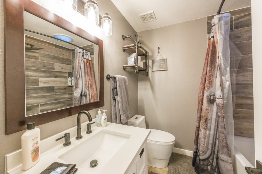 Bathroom #2 located in East-wing, with amazing custom rain-shower/deep bath combo. Hair dryer, shampoo/conditioner, body wash, extra large and soft bath towels included.  