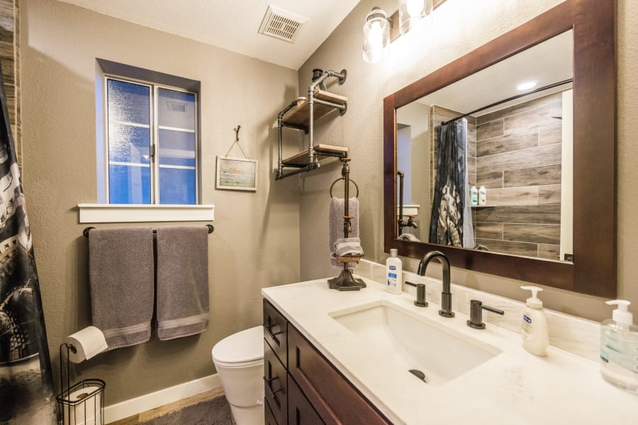 Bathroom #4: West Wing Guest Bathroom with Rain Shower/Tub Combo, large soft bath towels, hair dryer.