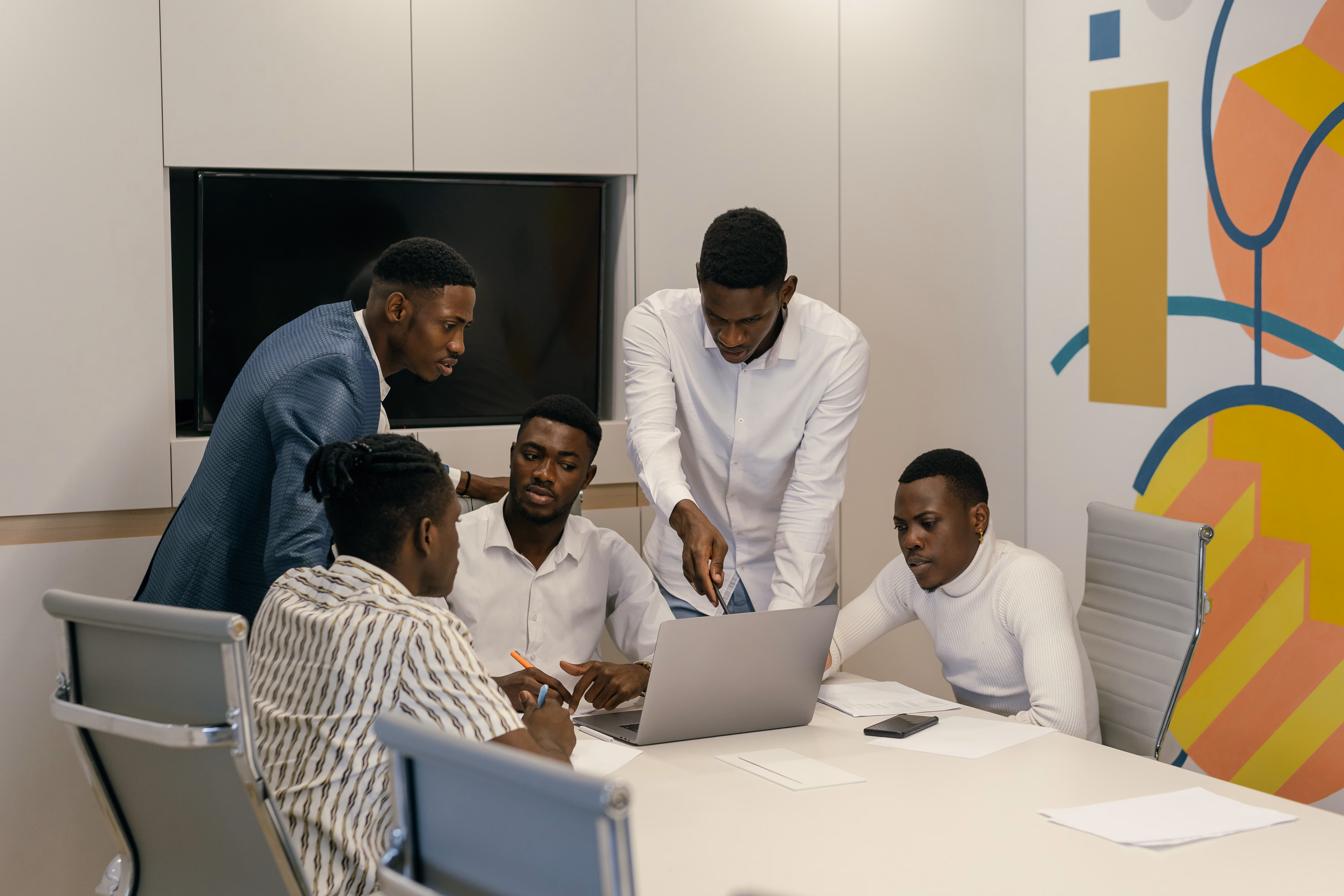 Colleagues discussing a shared project around a table