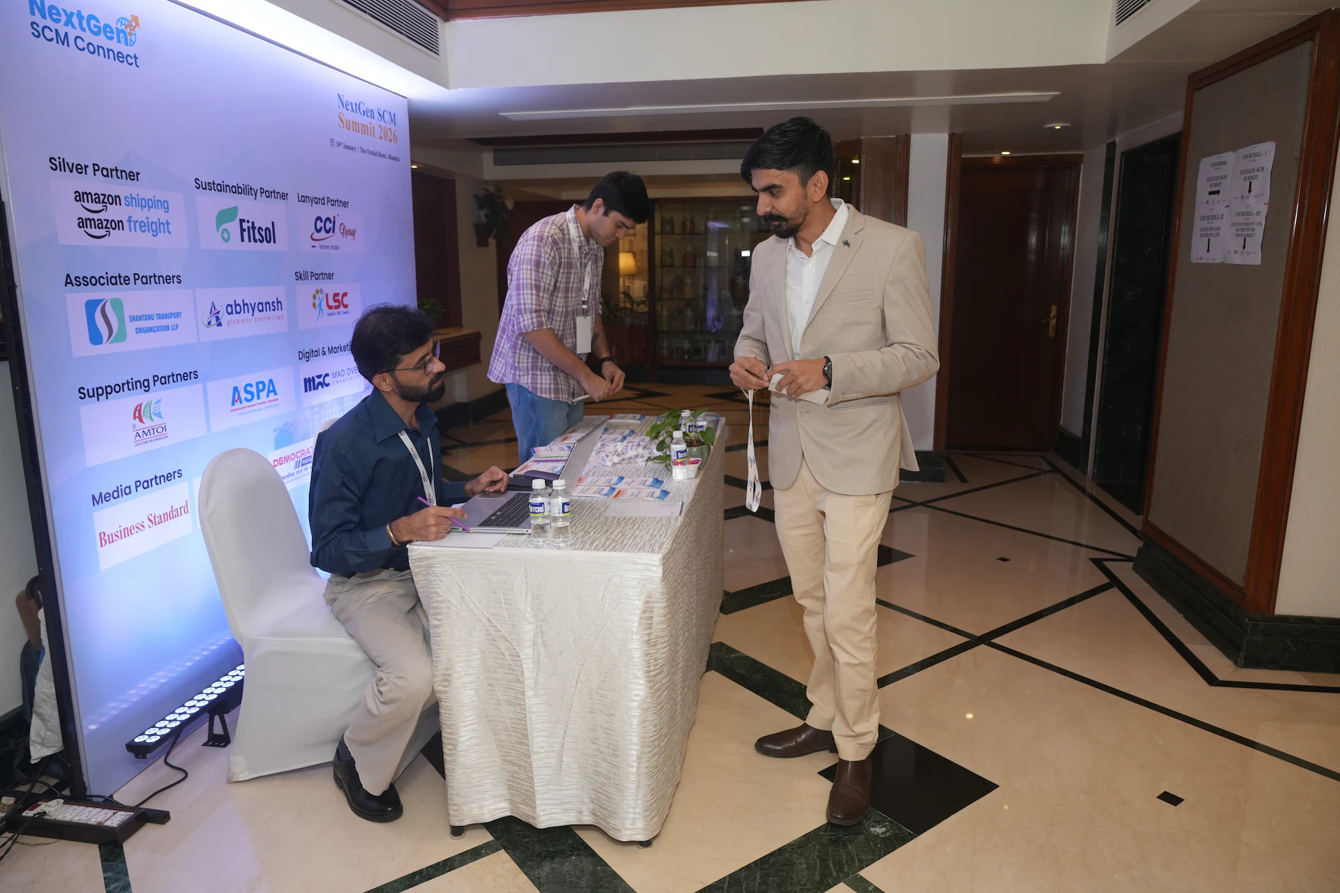 Participants checking in and receiving event materials