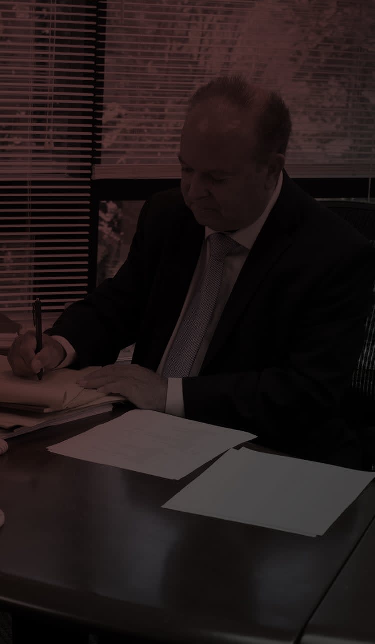 Alan Zegas sitting at a desk