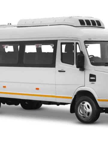 Force Tempo Traveller group tourist minibus featuring high roofline, roof-mounted climate control AC, and wide panoramic windows.