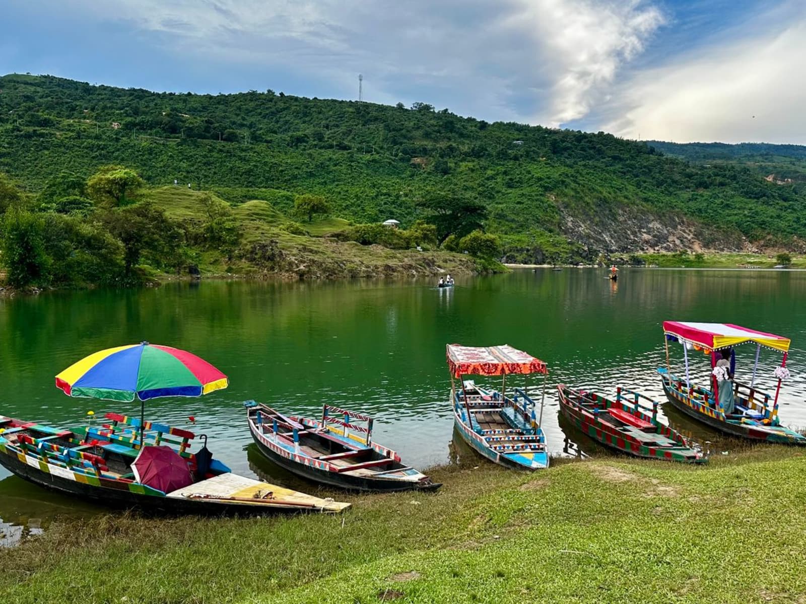 Tranquil blue waters and pine-forested hills surrounding Umiam Lake near Shillong
