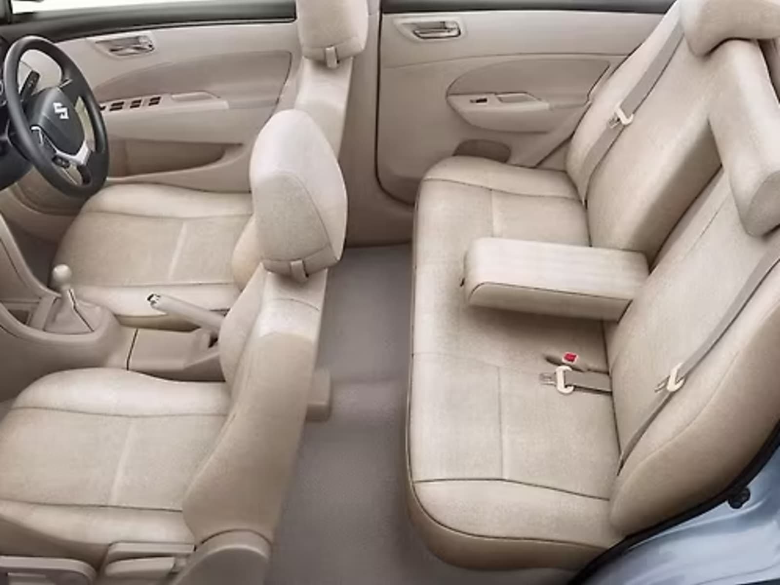 Maruti Suzuki Dzire passenger cabin featuring plush beige fabric seats, rear central armrest with cup holders, and ergonomic legroom.