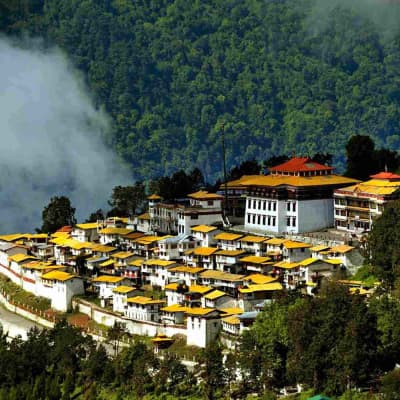 The grand courtyard and ornate prayer halls of Tawang Monastery.