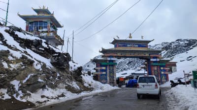The iconic gateway at Sela Pass overlooking high Himalayan ridges.