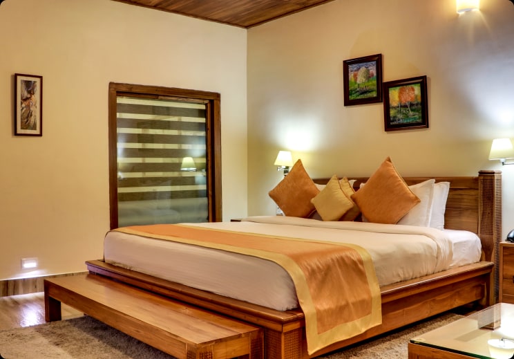 Floor-to-ceiling window walls frame pristine natural flora scenes.
