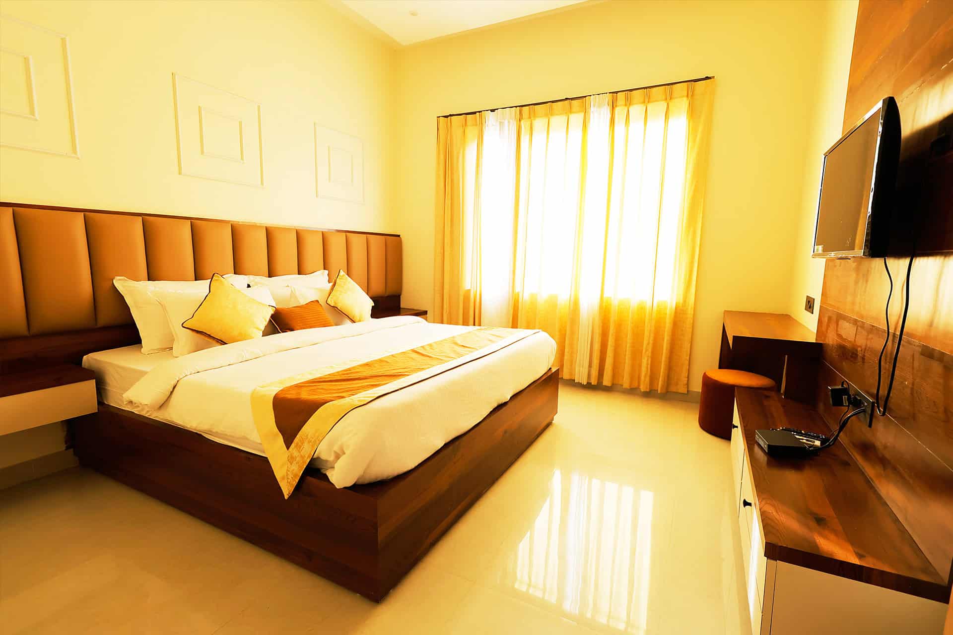 Spacious suite quarters offer refined comfort with custom timber joinery and warm ambient interior lighting.