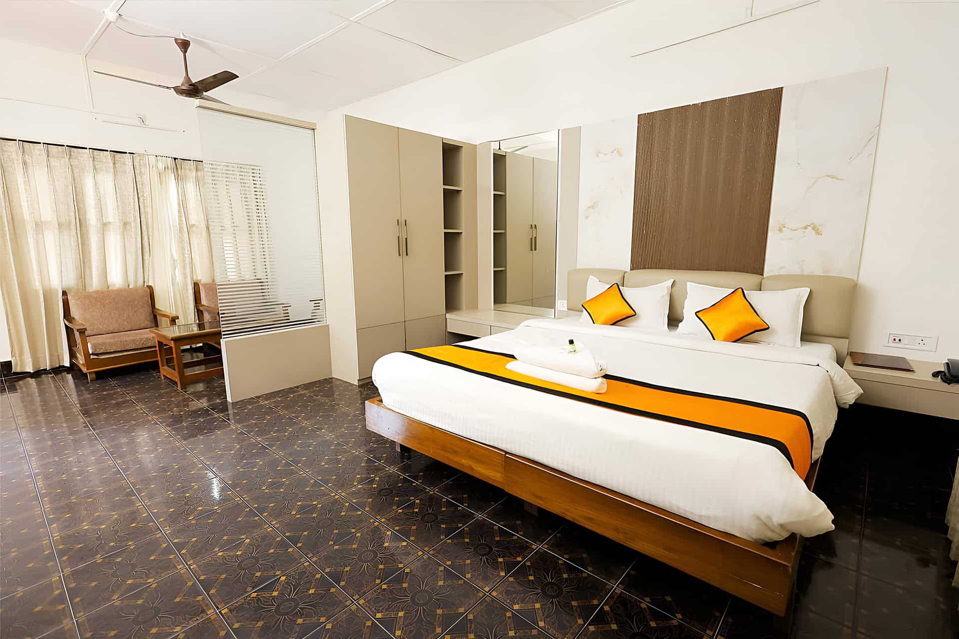 Independent cottages provide spacious bedroom layouts with full wardrobe storage and seating corners.