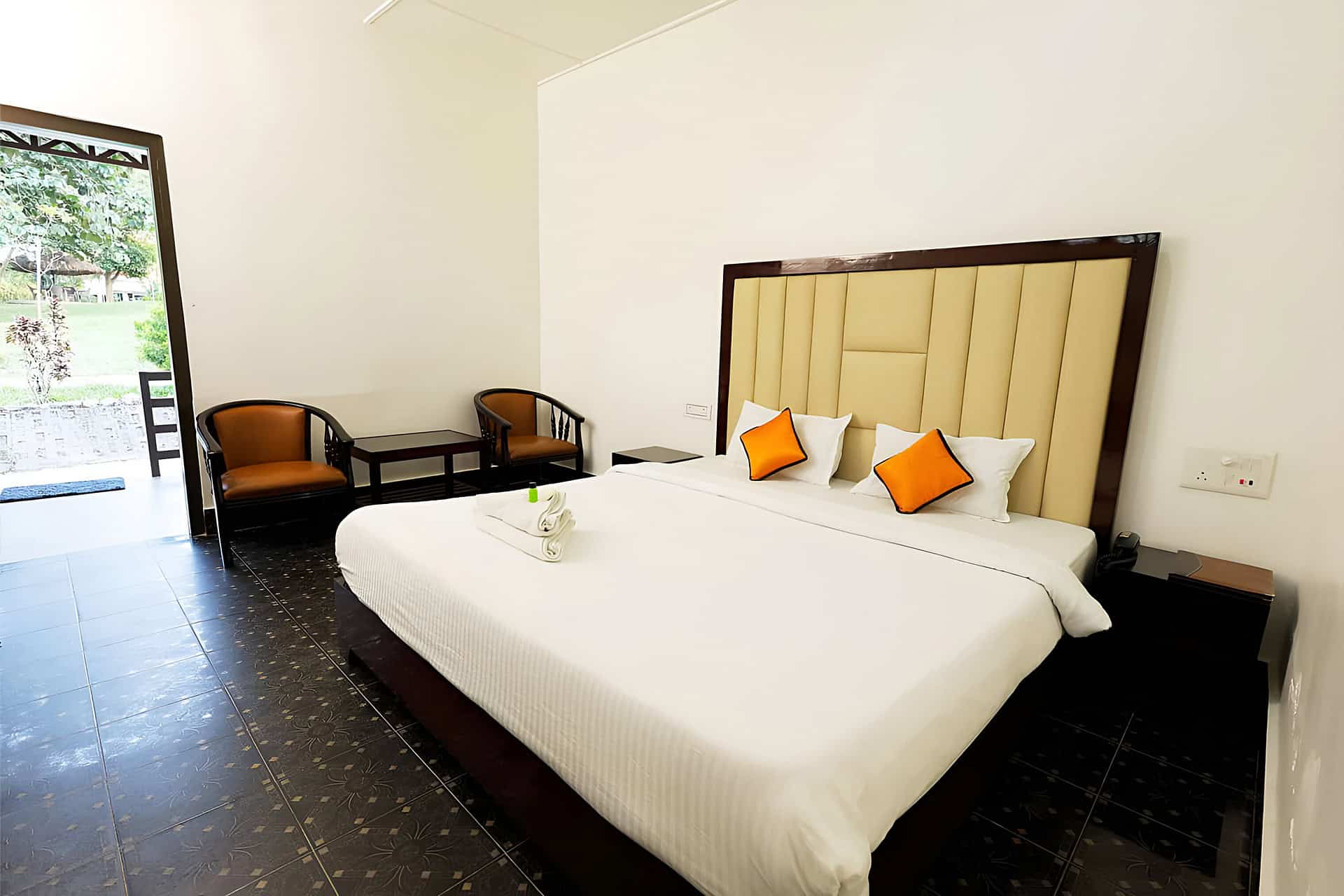 Deluxe guest units feature direct doorway access to outdoor patio spaces and garden lawns.