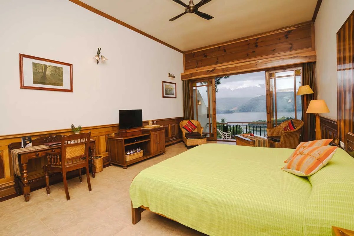Superior Lake Room provides a comfortable king bed layout, dedicated writing desk, and large glass doors to the private balcony.