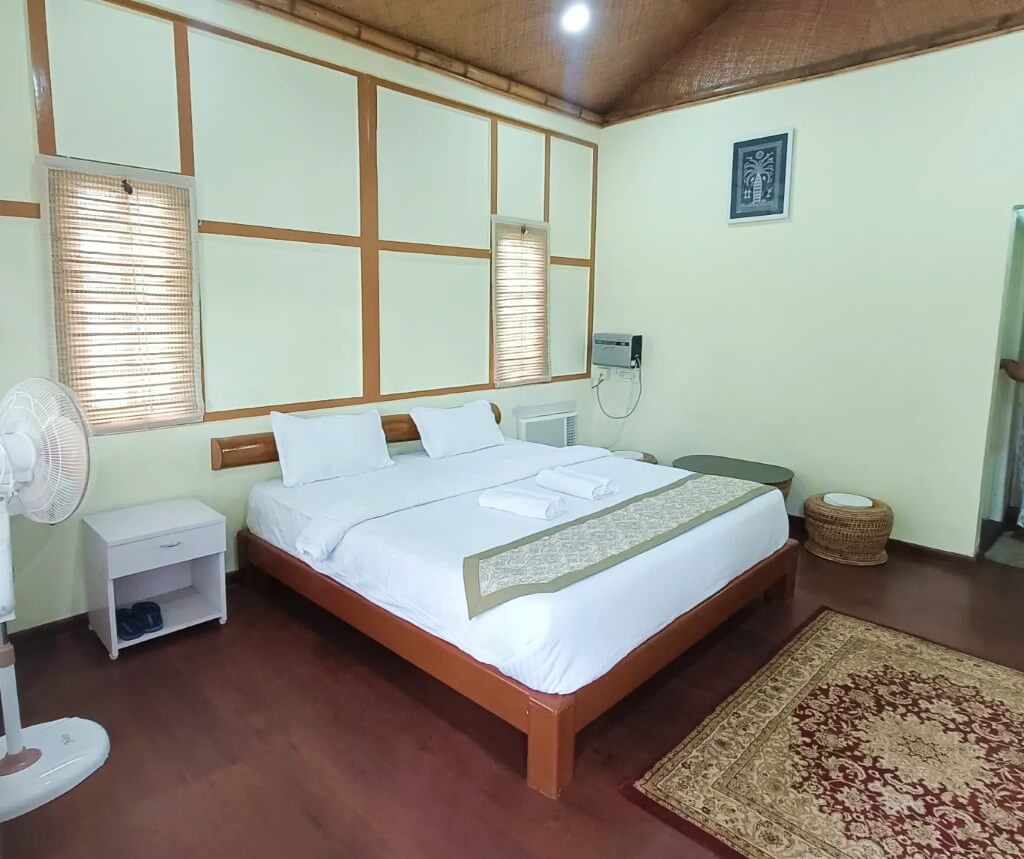 River View Executive AC Double Room with plush king bed and private veranda