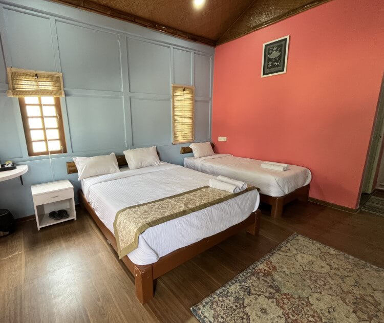River View Executive AC Triple Room configured for families with 1 king and 1 single bed