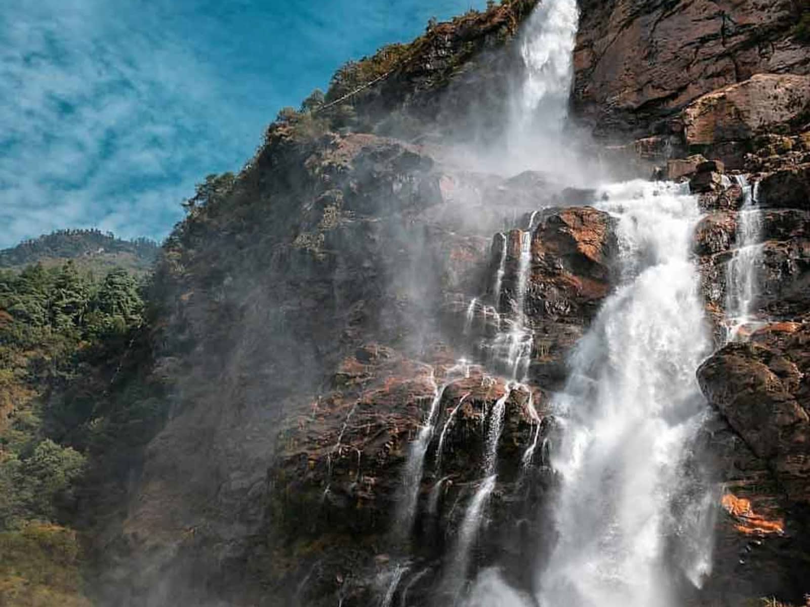 Scenic gallery view of Nuranang Waterfall plunging into the canyon