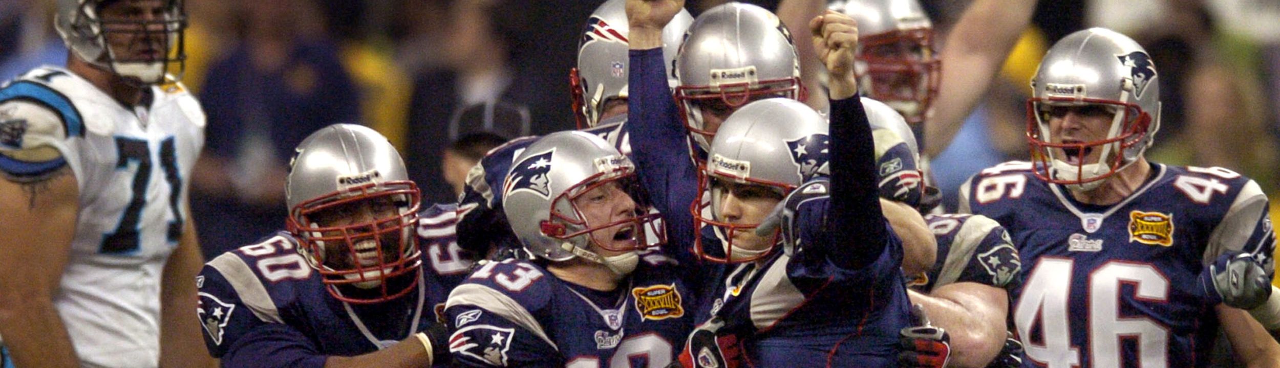 Patriot's kicker Adam Vinatieri (4) celebrates with Ken Walter (13