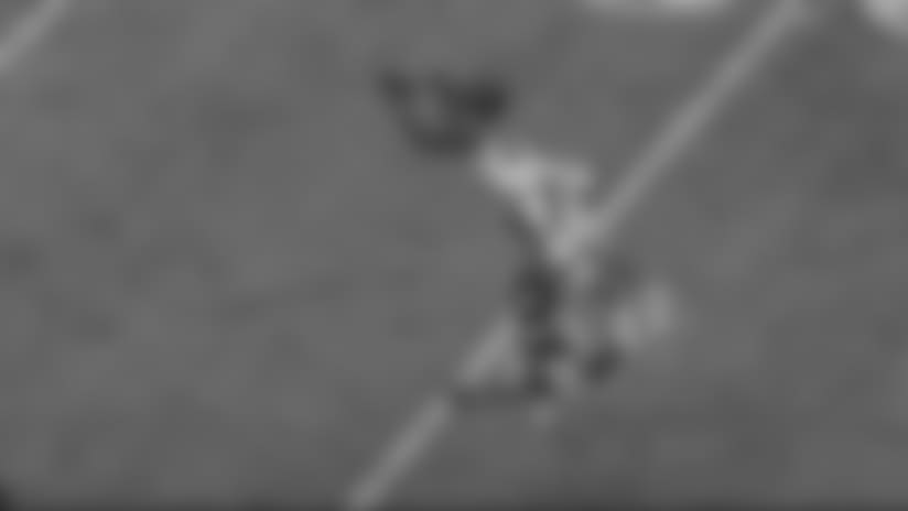 Kirkpatrick leaps and intercepts Manning