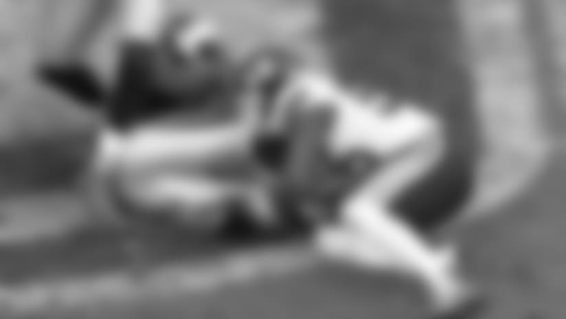 Dee Ford bursts through the line to stuff Fozzy Whittaker for a loss