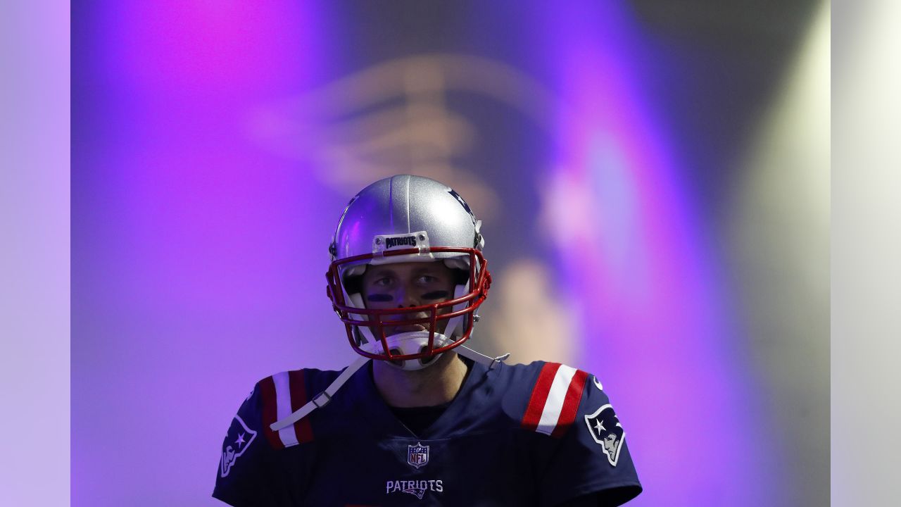 New England Patriots quarterback Tom Brady (12) looks on as he makes his way to the field prior to a week 7 NFL football game against the Atlanta Falcons on Sunday, Oct. 22, 2017, in Foxborough, Mass. (Aaron M. Sprecher via AP)