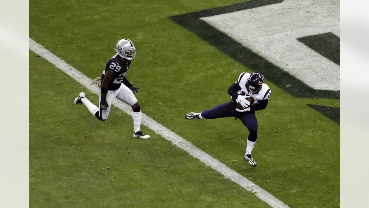 Oakland Raiders fullback Jamize Olawale powers through the line to