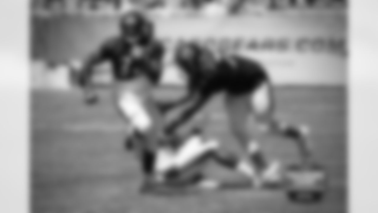 RB Jeremy Langford (33) and OL Charles Leno (72).