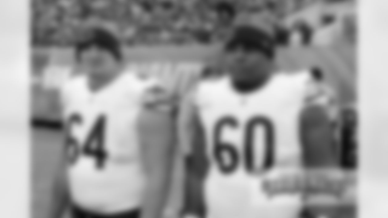 OL Eric Kush (64) and OL Cornelius Edison (60).