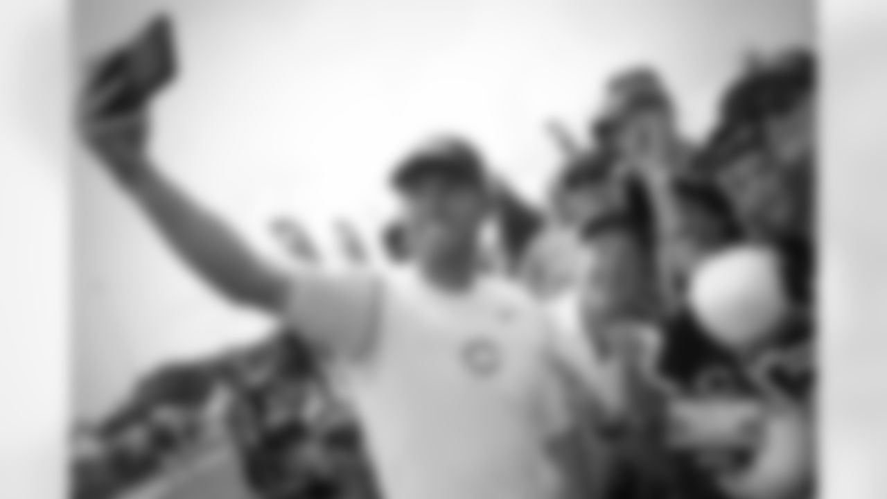 K Robbie Gould and head coach John Fox take a selfie with fans after practice.
