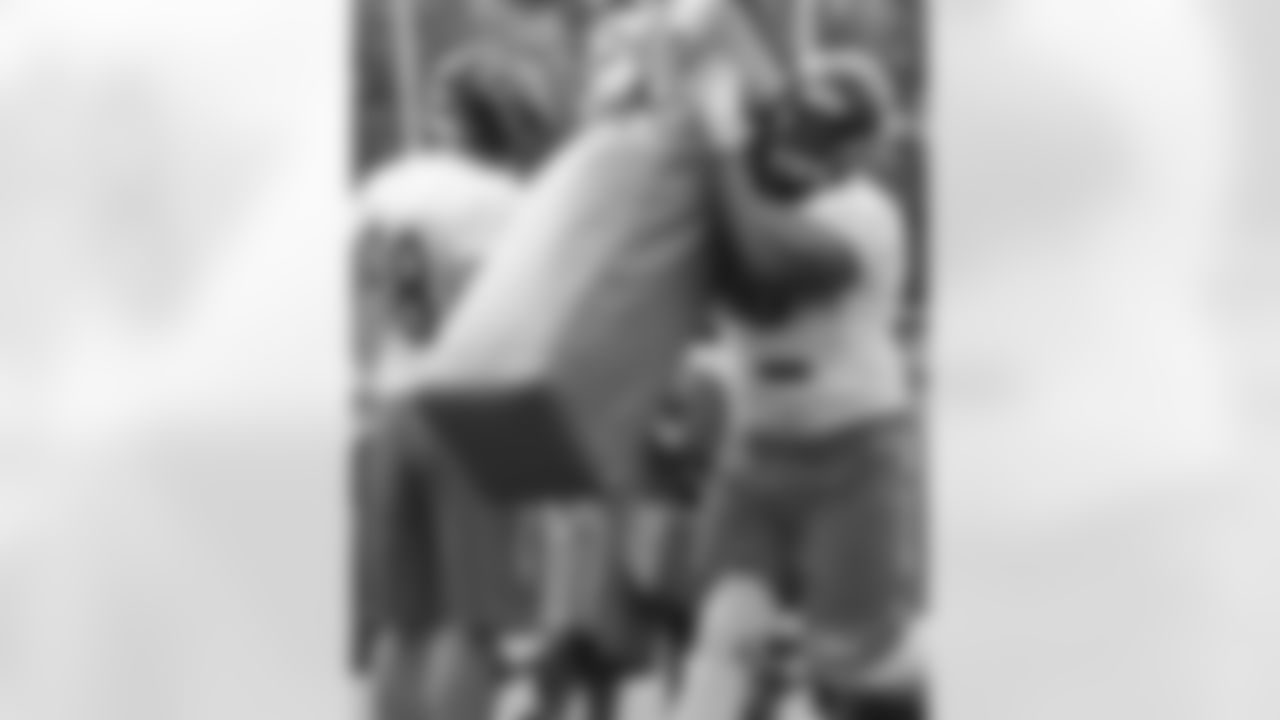 DL Cornelius Washington (90) and DL Mitch Unrein (98)