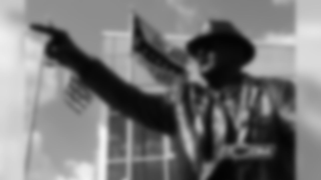The pointing of George Halas' finger outward from the building was the chosen pose by owner Virginia McCaskey to be as if George Halas is saying, "Let's go get 'em."