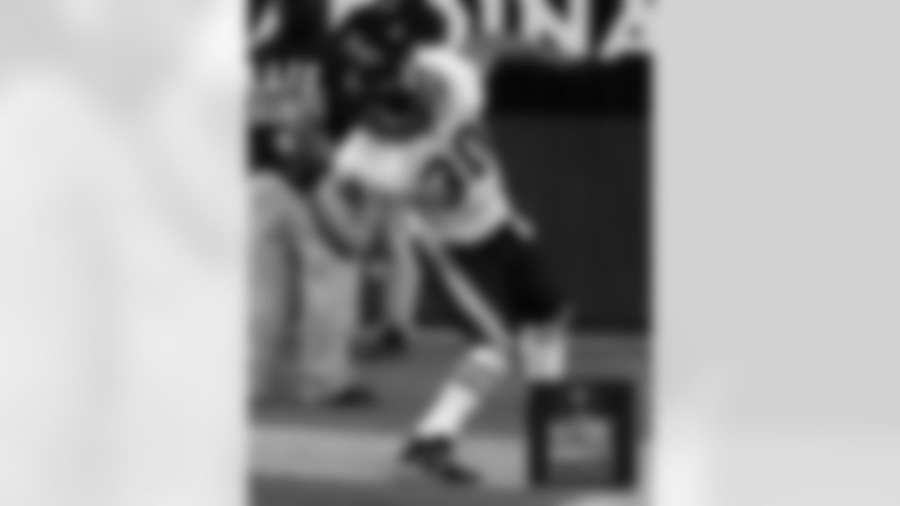 Mike Brown throws the ball into the stands after picking up a fumble and scoring in the third quarter. Bears Historic Moments - Chicago Tribune