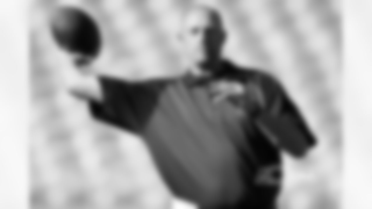Nagy throws a pass before a 2010 game then as a coaches assistant for the Eagles.