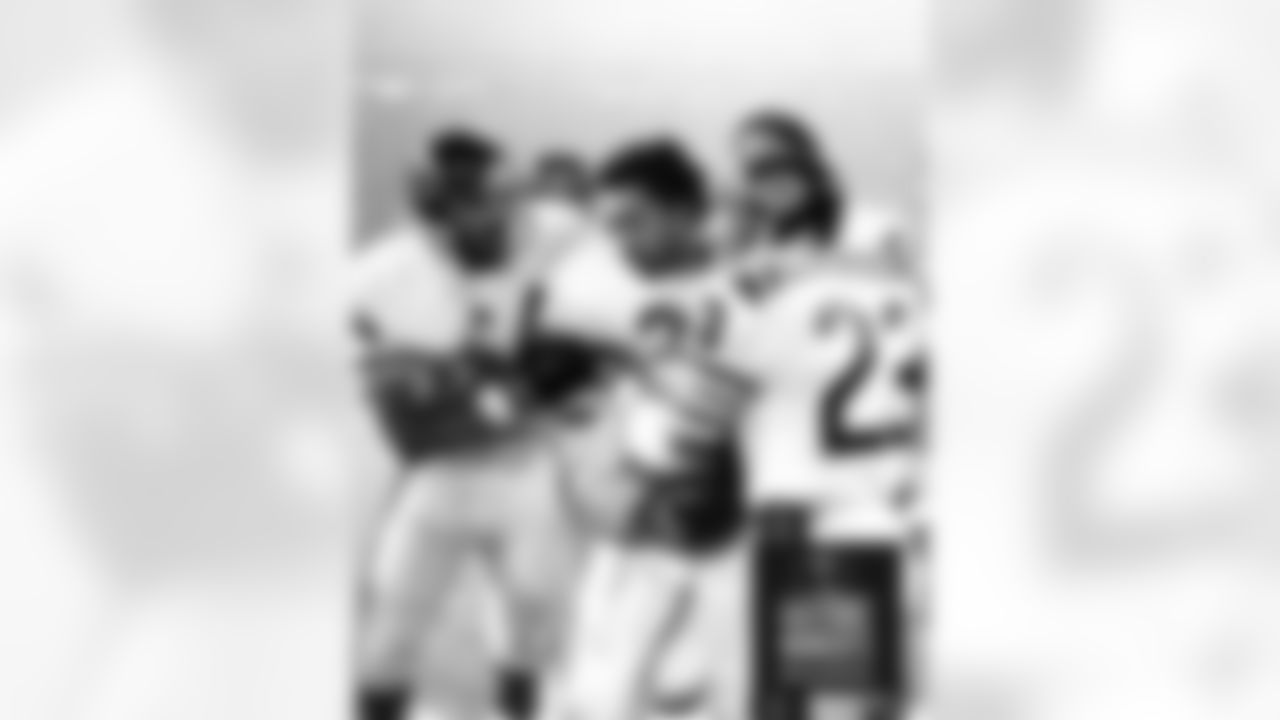 Bears teammates congratulate Dave Williams, center, after his 95-yard kick-off return gave the Bears a 23-17 overtime victory over the Lions in Detroit on Nov. 27, 1980. Bears Historic Moments - Chicago Tribune